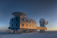 The Dark Sector Lab (DSL), located 3/4 of a mile from the Geographic South Pole, houses the BICEP2 telescope (left) and the South Pole Telescope (right). (<i>Steffen Richter, Harvard University</i>)